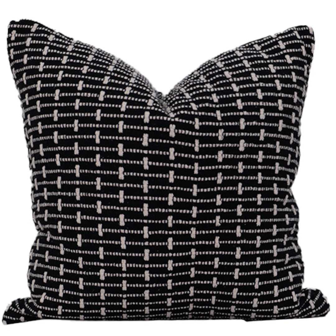 Black and white patterned pillow on a white background