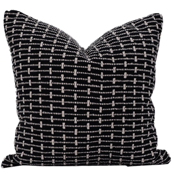 Black and white patterned pillow on a white background