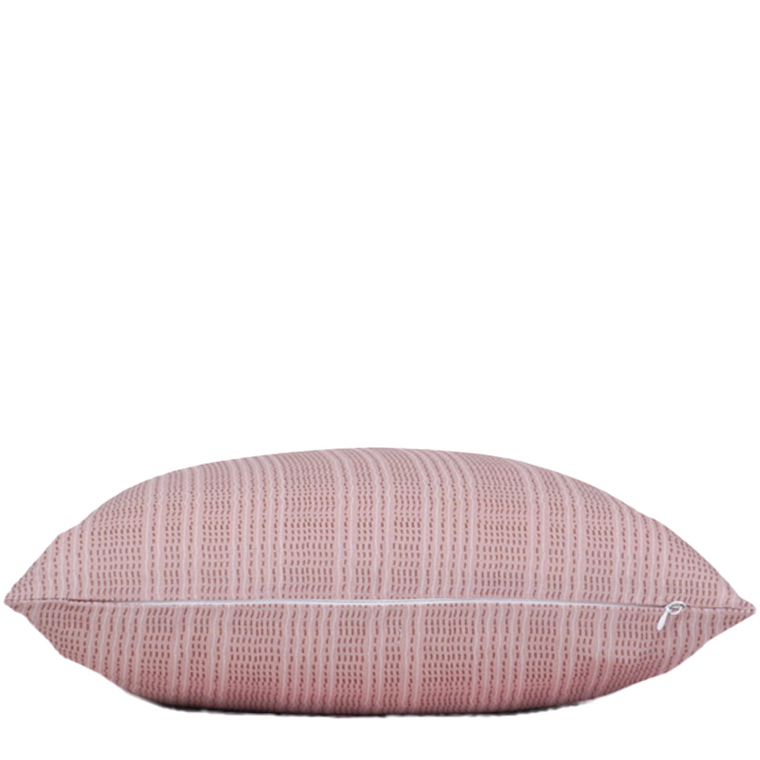 Pink textured pillow on a white background
