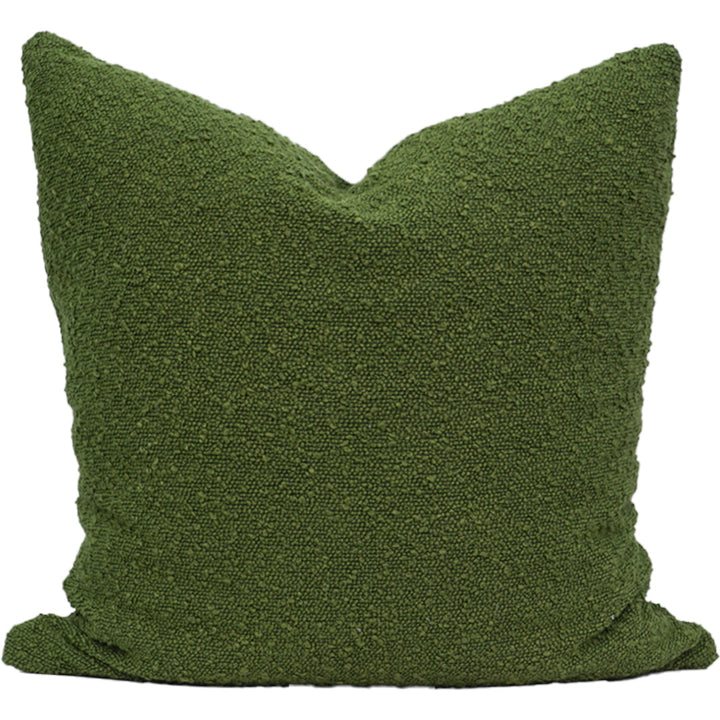 Green textured pillow on a white background