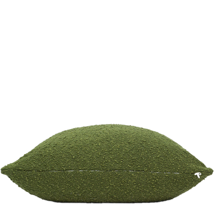 Green textured pillow on a white background