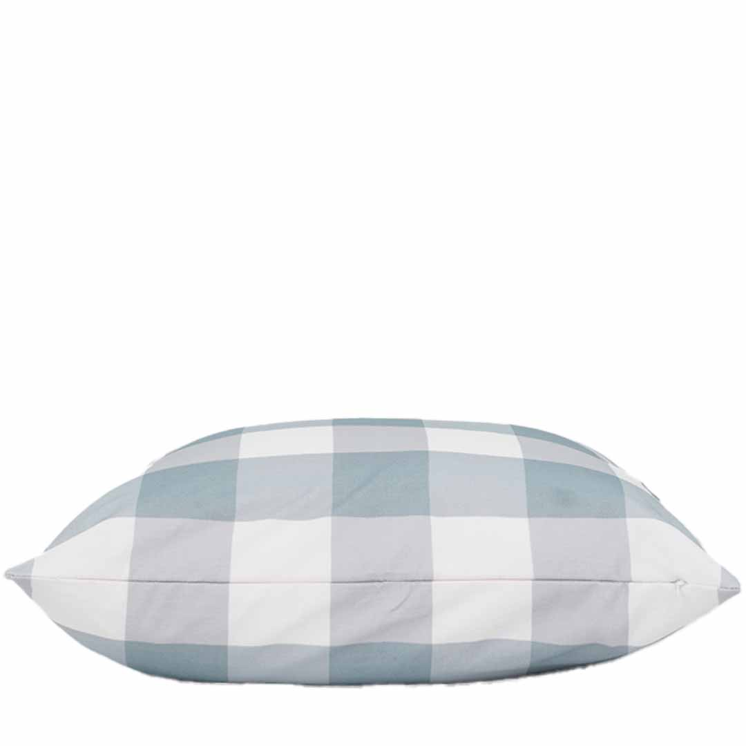 Checkered pillow with blue and white pattern on a white background
