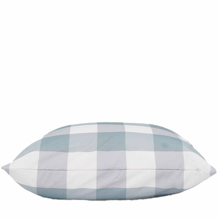 Checkered pillow with blue and white pattern on a white background