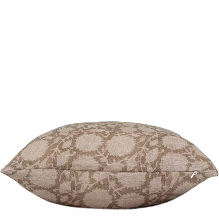 Decorative pillow with a beige floral pattern on a white background