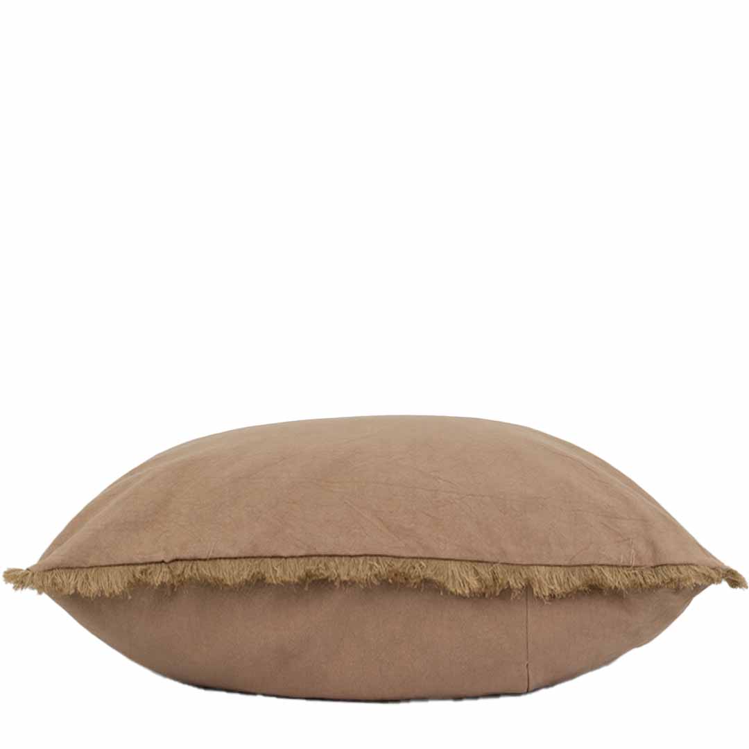 Brown pillow with frayed edge on a white background