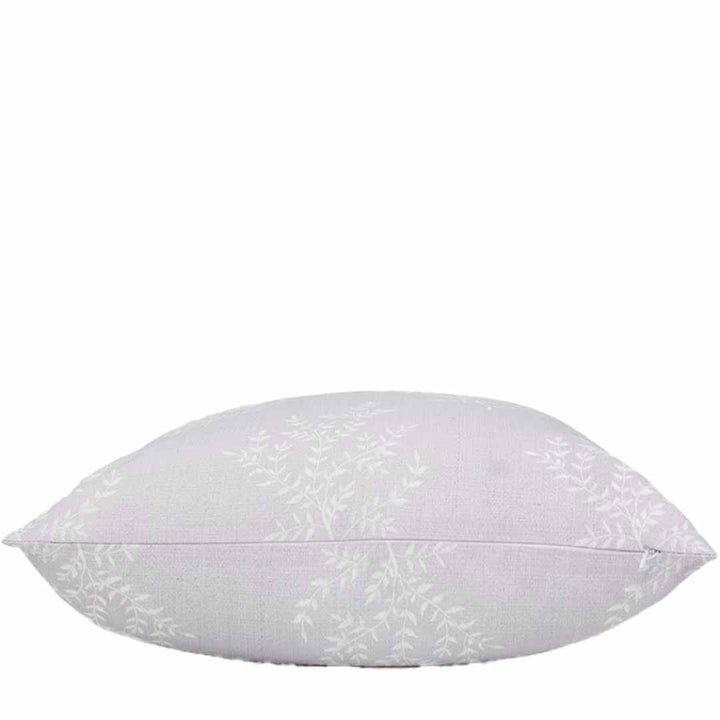 White pillow with subtle pattern on a white background